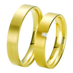Obrączki ślubne z żółtego złota z brylantem o masie 0,03 ct. Próbba 0,585